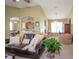 Open-concept living room featuring comfortable seating, archways, and a view of the dining area at 11021 Silver Dancer Dr, Riverview, FL 33579