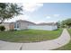 Spacious yard with a white picket fence, offering privacy and security for outdoor enjoyment at 11021 Silver Dancer Dr, Riverview, FL 33579