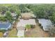 Aerial view of the home with a large backyard and mature trees and lush landscaping at 11315 N Armenia Ave, Tampa, FL 33612