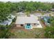 The backyard features a patio area, fenced yard, and tropical landscaping for outdoor living at 11315 N Armenia Ave, Tampa, FL 33612