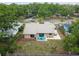 The backyard features a patio area, fenced yard, and tropical landscaping for outdoor living at 11315 N Armenia Ave, Tampa, FL 33612