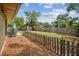 The backyard combines mulched areas, a spacious lawn, and secure fencing to enhance privacy and safety at 11315 N Armenia Ave, Tampa, FL 33612