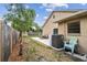 Spacious backyard featuring a seating area, privacy fence and palm tree at 11315 N Armenia Ave, Tampa, FL 33612