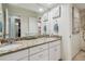 Bright bathroom featuring dual sinks, granite countertops and ample storage space at 11315 N Armenia Ave, Tampa, FL 33612