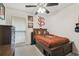 This carpeted bedroom features Florida State Seminoles themed decor and furniture at 11315 N Armenia Ave, Tampa, FL 33612
