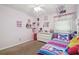 bedroom with carpet, ceiling fan, closet, and white dresser at 11315 N Armenia Ave, Tampa, FL 33612