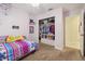 bedroom with pink walls, carpeted floor and closet at 11315 N Armenia Ave, Tampa, FL 33612
