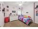 bedroom with carpet, ceiling fan, closet, and white dresser at 11315 N Armenia Ave, Tampa, FL 33612