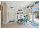 Bright dining area showcasing a modern table set and access to the yard through sliding doors at 11315 N Armenia Ave, Tampa, FL 33612