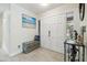 Inviting entryway featuring stylish bench seating, a double-door entry, and tile floors at 11315 N Armenia Ave, Tampa, FL 33612