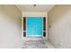 Inviting front entrance featuring a vibrant turquoise door with sidelights at 11315 N Armenia Ave, Tampa, FL 33612