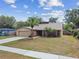 Charming single-story home with a well-manicured lawn and a two-car garage at 11315 N Armenia Ave, Tampa, FL 33612