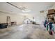 A spacious garage featuring a washer, dryer, and shelving, offering ample storage and utility space at 11315 N Armenia Ave, Tampa, FL 33612