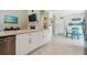 Bright kitchen with stainless appliances, granite counters, and an eat-in area at 11315 N Armenia Ave, Tampa, FL 33612