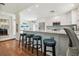 Modern kitchen with a breakfast bar, stainless steel appliances, and updated countertops at 11315 N Armenia Ave, Tampa, FL 33612