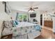 Inviting main bedroom features wood floors, ensuite, and tranquil color palette at 11315 N Armenia Ave, Tampa, FL 33612