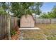 A wooden backyard shed provides extra outdoor storage at 11315 N Armenia Ave, Tampa, FL 33612
