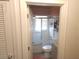 Hall bathroom featuring white tiled walls and shower at 116 S Arrawana Ave, Tampa, FL 33609
