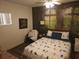 Comfortable bedroom with neutral walls, natural light, and colorful accents at 116 S Arrawana Ave, Tampa, FL 33609