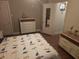 Bedroom with a double dresser and lots of natural light at 116 S Arrawana Ave, Tampa, FL 33609