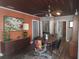 Comfortable dining room featuring hardwood floors, vibrant furniture, and vintage accents at 116 S Arrawana Ave, Tampa, FL 33609