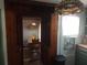 Arched hallway with built-in shelves overlooking dining area at 116 S Arrawana Ave, Tampa, FL 33609