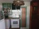 A white oven is placed in a kitchen with green shelving and wood counters at 116 S Arrawana Ave, Tampa, FL 33609