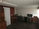 A functional room featuring wood paneling, countertop, microwave and new floors at 116 S Arrawana Ave, Tampa, FL 33609