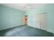 This bedroom features a ceiling fan, light blue walls and a closet at 12002 Hope Ln, Tampa, FL 33618