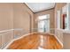 Elegant dining room with beautiful wood floors, arched doorway and chandelier at 12002 Hope Ln, Tampa, FL 33618