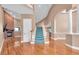Open floor plan with wood floors, staircase and elegant architectural features at 12002 Hope Ln, Tampa, FL 33618
