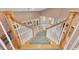 Entry foyer staircase with hardwood floors, natural light, and elegant spindles at 12002 Hope Ln, Tampa, FL 33618