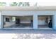 Attached two-car garage with shelving, storage, and lighting at 12002 Hope Ln, Tampa, FL 33618