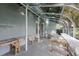 Enclosed greenhouse with work tables, ideal for starting seedlings and enjoying the outdoors in any weather at 12002 Hope Ln, Tampa, FL 33618