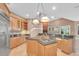 Spacious kitchen featuring granite countertops, custom cabinets, and seamless access to the living room at 12002 Hope Ln, Tampa, FL 33618
