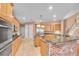 Well-equipped kitchen with stainless steel appliances, custom cabinets, and tile flooring at 12002 Hope Ln, Tampa, FL 33618