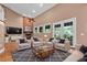 Cozy living room with fireplace, TV, hardwood floors, and four armchairs at 12002 Hope Ln, Tampa, FL 33618