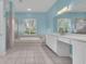 Serene Primary bathroom with a soaking tub, a walk-in shower, and double sink vanity at 12002 Hope Ln, Tampa, FL 33618