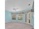 Tranquil main bedroom with double doors leading outside and serene natural light, perfect for rest at 12002 Hope Ln, Tampa, FL 33618