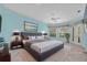 A beautiful main bedroom, well-appointed with a stylish king bed and tranquil outdoor views at 12002 Hope Ln, Tampa, FL 33618