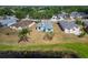 Aerial view of the rear of the homes with the waterfront landscape and abundant green space at 12119 Buffington Ln, Riverview, FL 33579