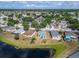 A beautiful aerial view of the neighborhood homes and a pond in a lush landscaped surrounding at 12119 Buffington Ln, Riverview, FL 33579