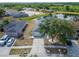 Charming single-Gathering home featuring a well-manicured front yard and a view of a serene lake at 12119 Buffington Ln, Riverview, FL 33579