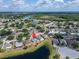 Sprawling community view with the home identified by a red pin, surrounded by lush greenery and lakes at 12119 Buffington Ln, Riverview, FL 33579