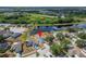 An aerial view of the houses in a picturesque community with a peaceful lake at 12119 Buffington Ln, Riverview, FL 33579