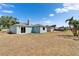 Spacious backyard with blue siding, chimney, and grassy area at 12119 Buffington Ln, Riverview, FL 33579