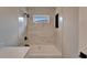 Modern bathroom featuring a tub shower with tile surround and black hardware at 12119 Buffington Ln, Riverview, FL 33579