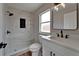 Modern bathroom features a tiled shower with a matte black shower head and a white vanity with matte black hardware at 12119 Buffington Ln, Riverview, FL 33579