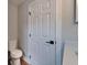 This renovated bathroom features a toilet and door. Vanity is out of frame at 12119 Buffington Ln, Riverview, FL 33579