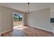 Dining area with natural light, a modern chandelier, and a backyard view at 12119 Buffington Ln, Riverview, FL 33579
